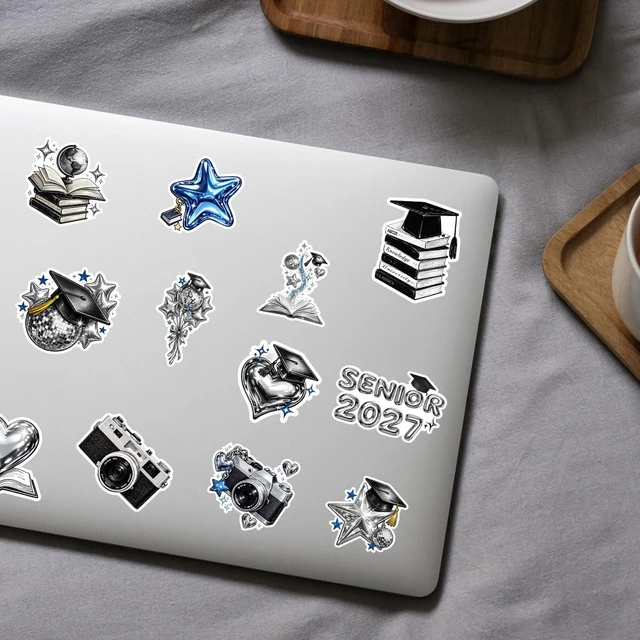 Alt view image 4 of 7 - 16pcs-3in Senior 2027 Stickers, Silver Graduation Pack Scarpbook Decoration, silver chrome look with black and blue accents, featuring caps, books, globes, hearts and stars