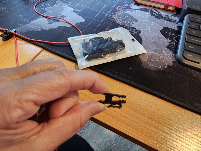 Alt view image 2 of 3 - Headphone Wire Clip for Shirt, Black, 12Pcs