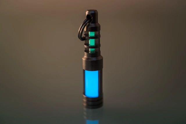 Alt view image 2 of 7 - Isotope Chain Reaction Fob - Hybrid Embrite Glow Fob Pellet (Aqua) and Stainless Steel Housing for 3x11mm Tritium Vial - EDC Tritium Keychain Accessory - Cool Keychains Accessories