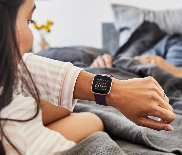 Alt view image 3 of 5 - Versa 2 Health and Fitness Smartwatch with Heart Rate, Music, Alexa Built-in, Sleep and Swim Tracking, Bordeaux/Copper Rose, One Size (S and L Bands Included)