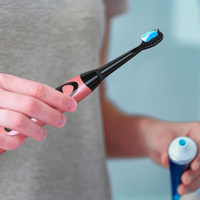 Alt view image 6 of 7 - Sonic-FX Solo Electric Toothbrush w/ 10 Brush Heads + 1 Interdental, Charcoal Bristles, Rechargeable, Charging/Storage Base, 3 Brush Modes, Smart Timer, 2 Months Use on Full Charge, Coral Color