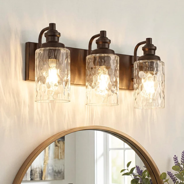 Main image of FYNVEX 3-Light Bathroom Vanity Light Fixture Over Mirror, Oil-Rubbed Bronze | Clear Hammered Cylindrical Glass Shades, Metal Frame, Rippled Glow, Wall Mount Up or Down, E26 Socket, Hardwired, 120V