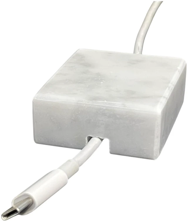 Main image of Craftsman Stoneworks Cord Organizer Polished Marble Cable Tidy, Single | Handmade polished marble cord holder for nightstands and desks. Fits most USB and phone charging cables. Non-slip.