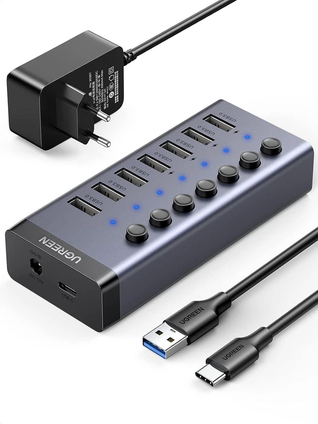 Main image of UGREEN USB Hub 7 Port with Independent Switch and 24 W Power Supply (12 V/2 A) USB Hub 3.0 Active for Charging and Data Transfer Aluminium Housing Compatible with MacBook, Surface Pro7 and Other