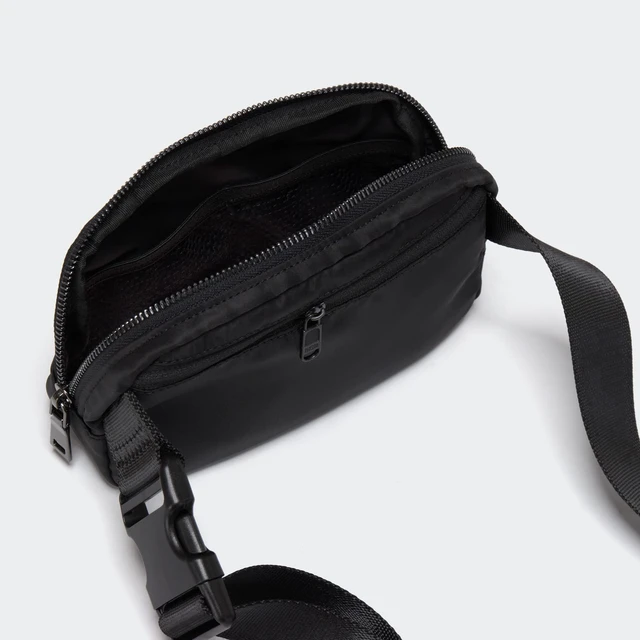 Alt view image 4 of 7 - Crossbody Belt Bag for Women and Men, Travel and Everyday Use, Black | Nylon belt bag with three mesh pockets, wide zipper opening and adjustable strap for crossbody or waist wear