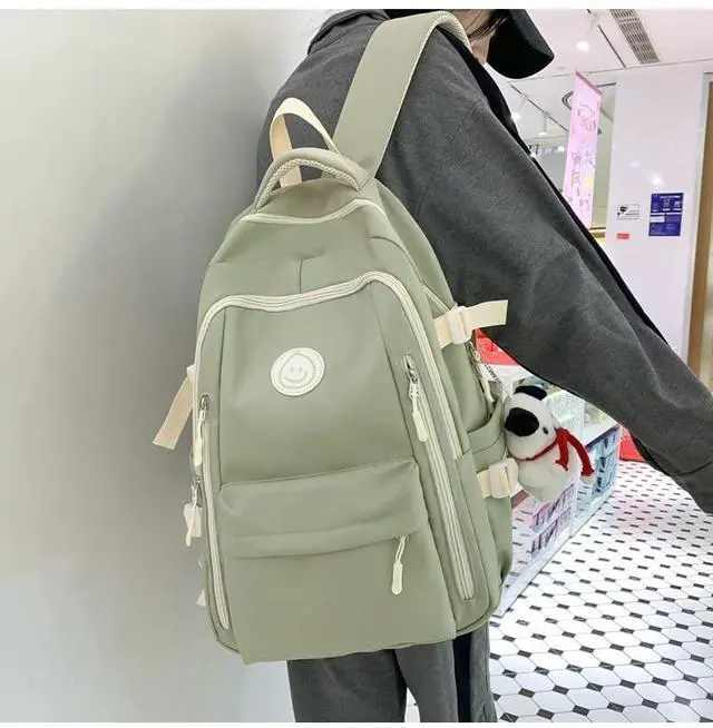 Alt view image 4 of 5 - MININAI Preppy Backpack with Cute Pendant Women Smile Face Laptop Backpack Kawaii Lightweight Aesthetic College Backpack (Sage Green,One Size)