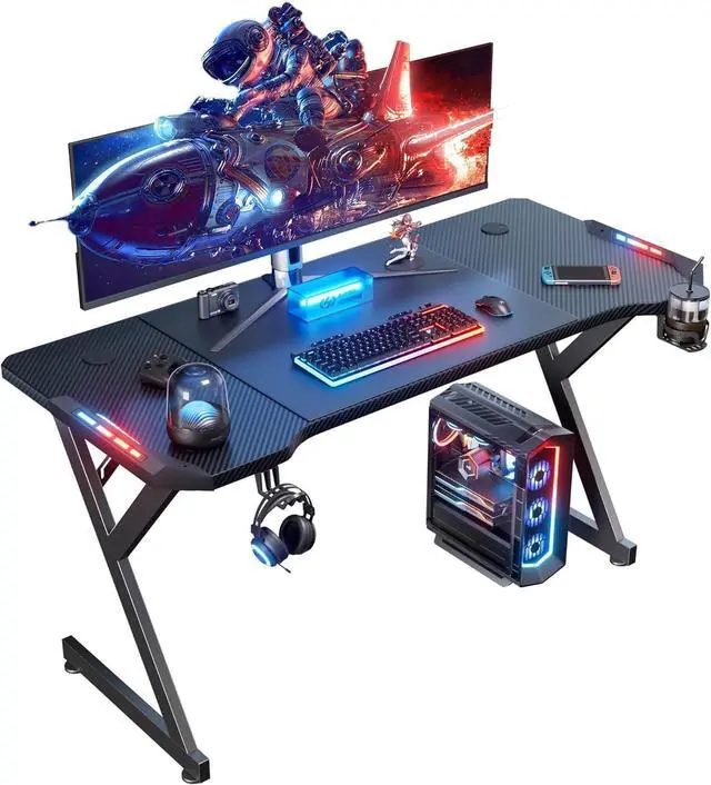 Main image of HLDIRECT 55 Inch Gaming Desk with LED Lights, Ergonomic Computer Gaming Table with Carbon Fibre Surface, Sturdy PC Workstation Desk for Gaming and Home Office with Headphone Hook, Cup Holder, Black