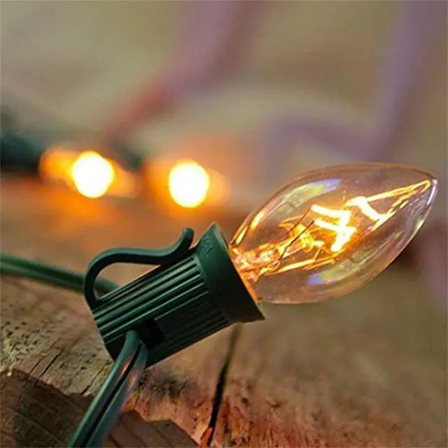 Alt view image 4 of 7 - SUNSGNE C7 Christmas Lights, 25Ft Outdoor Christmas String Lights with 27 Clear Warm White Incandescent Bulbs, Xmas Vintage String Light for Patio, Cafe, Party Decor, Green Wire