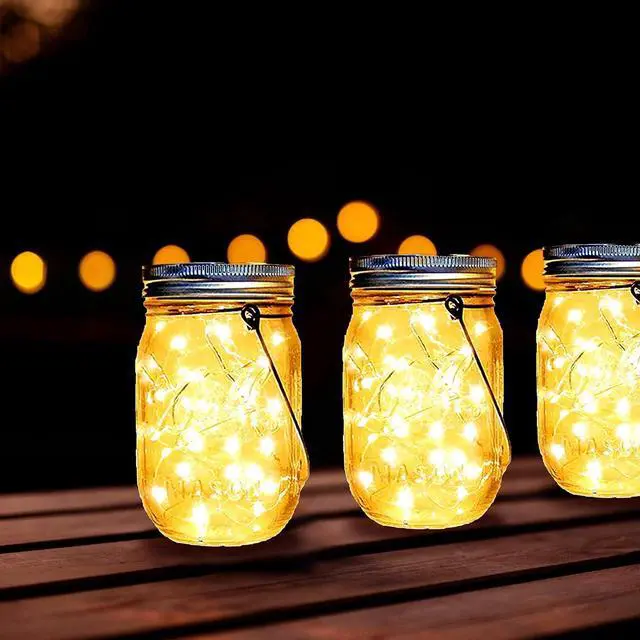 Alt view image 4 of 7 - Ostritec Solar Mason Jar Lights Lids, 12 Pack 30 Led Fairy Lights(Jars Not Included), Outdoor Hanging Mason Jar Solar Lights, Fairy in a Jar Firefly Lights for Patio Garden Table Decor Gifts