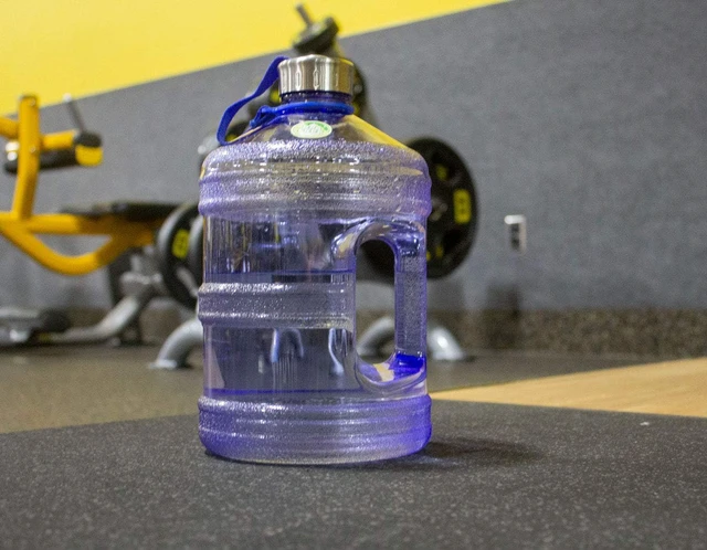 Alt view image 6 of 7 - New Wave Enviro Iconic 1 Gallon Round BPA Free Water Bottle with Stainless Steel Cap and Integrated Handle, Ideal for Gym and Outdoor Life, Blue
