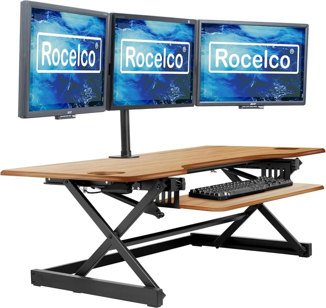 Main image of Rocelco 46" Large Height Adjustable Standing Desk Converter - Quick Sit Stand Up Triple Monitor Riser - Gas Spring Computer Workstation - Retractable Keyboard Tray - Teak Wood Grain (R DADRT-46)