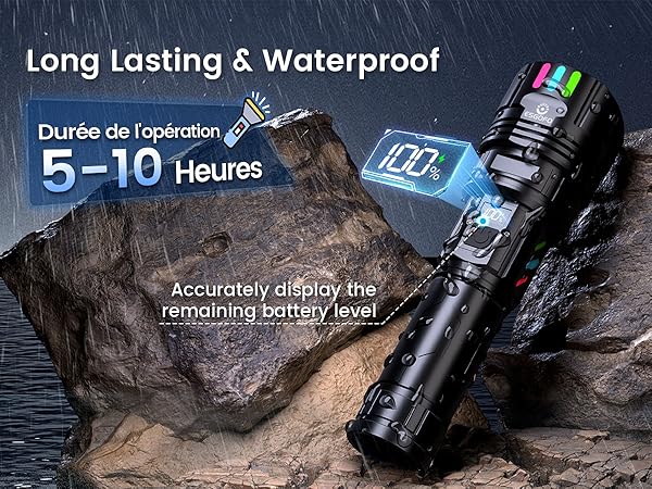 Waterproof tactical flashlight with digital battery indicator display, advertising 5-10 hours operation time, shown against rocky background.