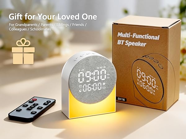 Text reads 'Gift for Your Loved One' and 'Multi-Functional BT Speaker'. Product image shows digital clock/speaker with LED display and remote control.