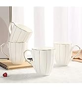 Set of four white ceramic mugs with vertical gold lines and gold rim. Mugs have a curved shape and handles. One mug is stacked on another.