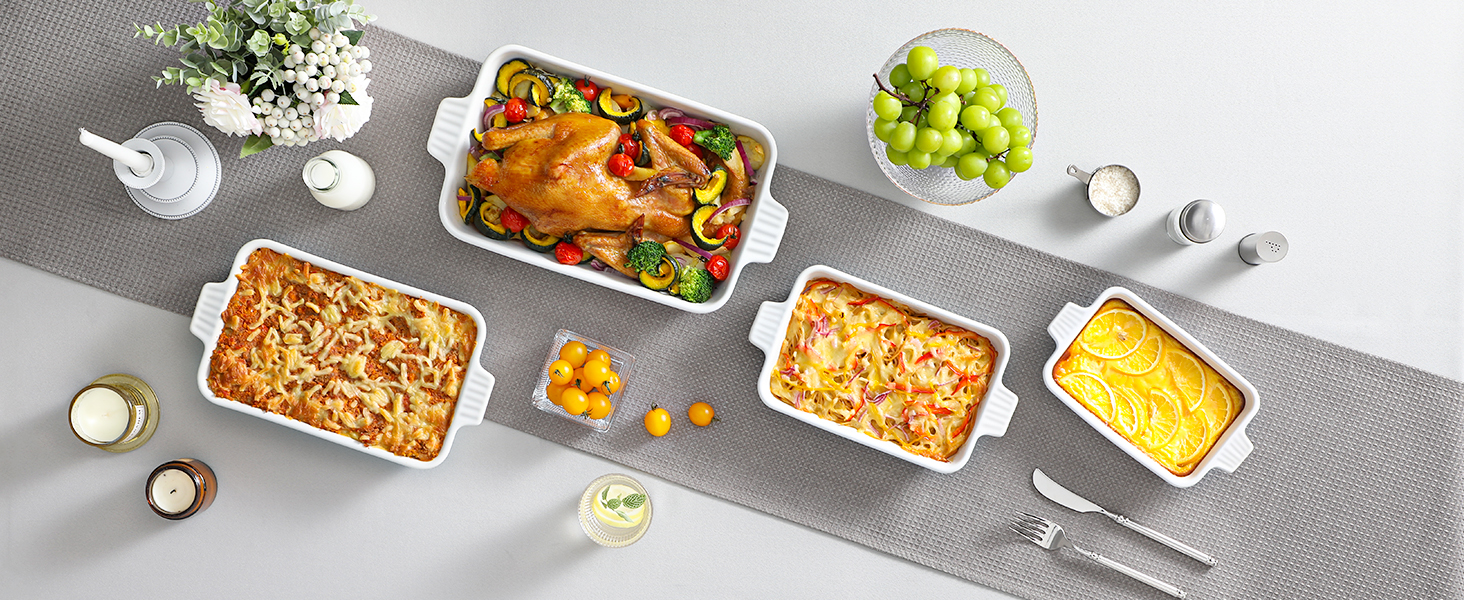 Overhead view of various dishes on a gray surface, including roasted chicken, side dishes, and condiments. Showcases a complete meal spread.