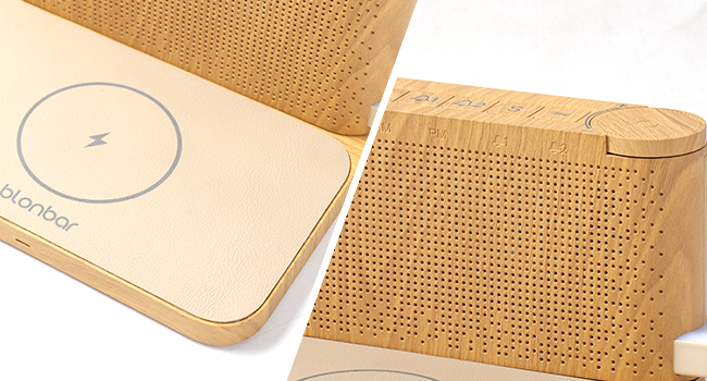 Two rectangular devices with wooden exteriors. One has a perforated surface, the other shows a circular icon. Both appear to be electronic devices.