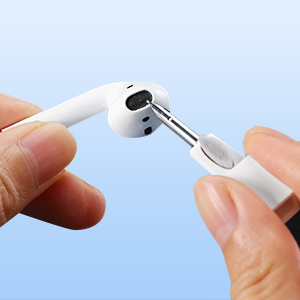 a hand holding a pair of headphones