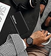 Man holding the PoweREC and recording while on the street