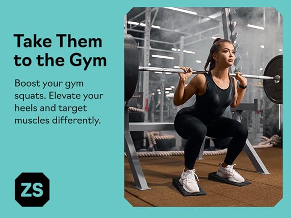 Woman doing barbell squats on slant board calf stretcher and squat wedge block at the gym