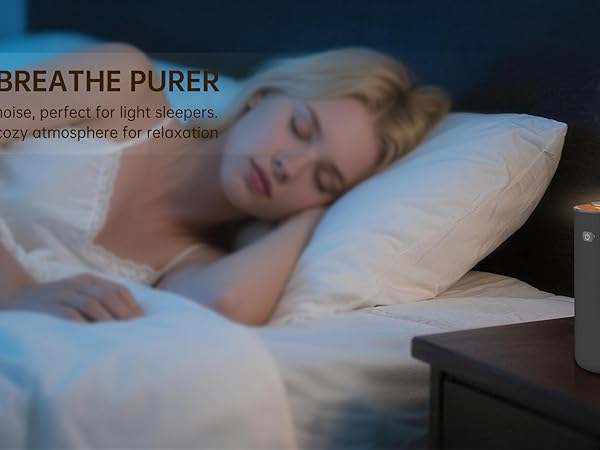 Text reads 'SLEEP BETTER, BREATHE PURER'. Marketing image showing diffuser or air purifier device on bedside table with mist effect.