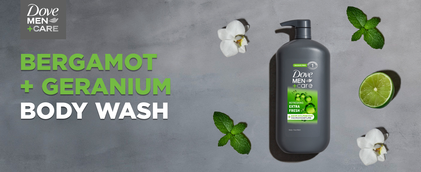 Pump bottle of Dove Men+Care Body Wash on a gray stone surface, surrounded by mint, flowers &amp; lime.