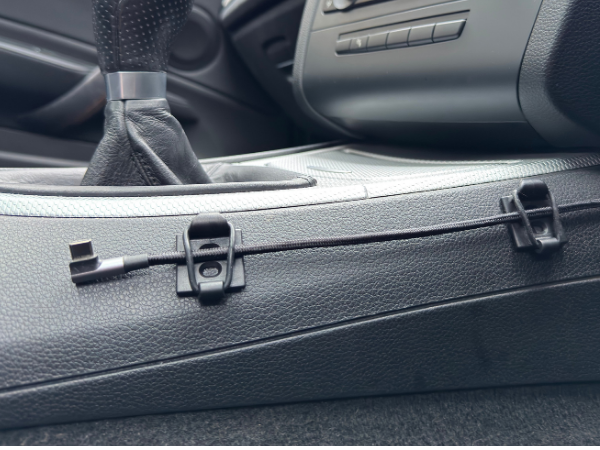 Securing cables in the car.