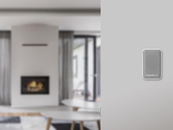 RDWL313P plugged into wall with a modern family room in the background.