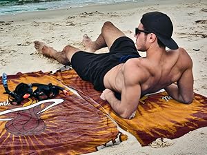 person laying on beach towel miami heat NBA