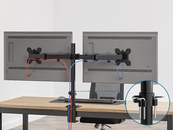 Dual monitor mount attached to desk. Shows adjustable arms, cable management, and close-up of clamp mechanism.