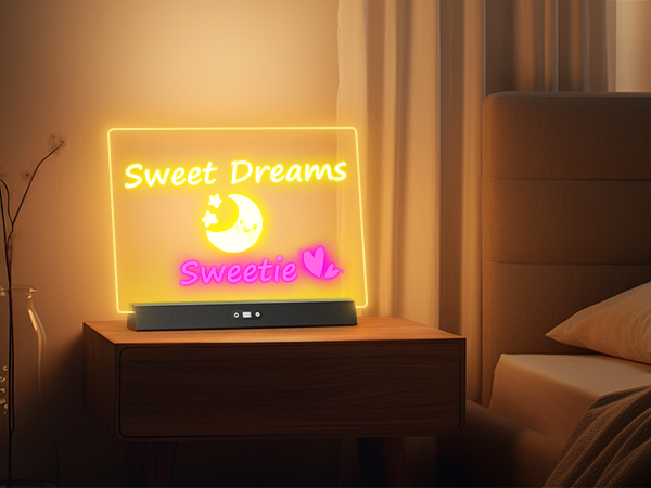 Illuminated LED sign on bedside table displaying 