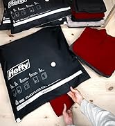 Shrink Pak Max bag being packed with sweaters.