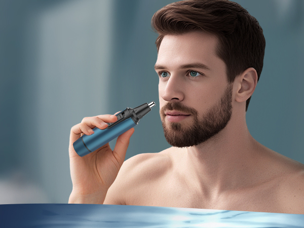 Person using a blue electric trimmer or grooming device against bathroom setting background.
