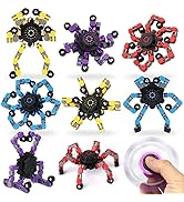 Collection of colorful spider-shaped fidget toys in yellow, purple, red, and blue variations, with black centers and articulated legs.