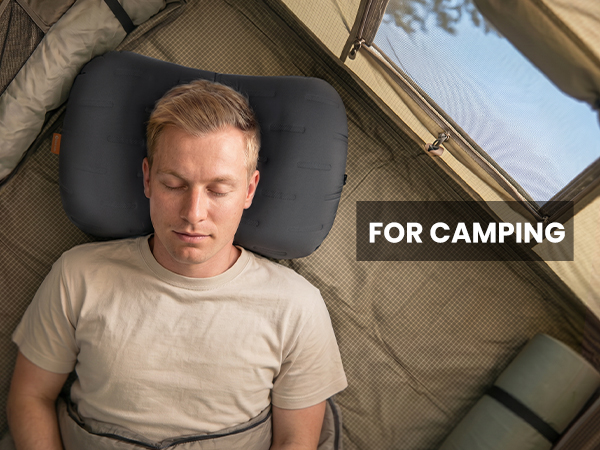 Camping pillow used inside a tent for outdoor sleeping comfort