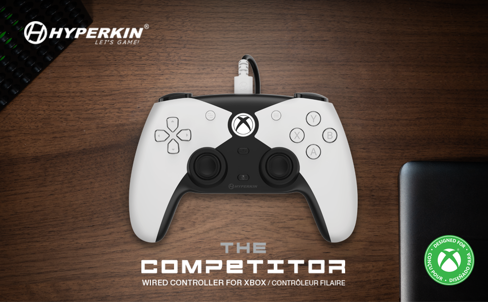 Hyperkin Xbox controller &amp;#34;The Competitor&amp;#34; in white/black on wood surface.