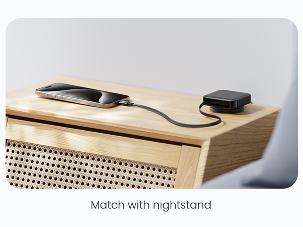 Wooden nightstand or side table with perforated pattern and built-in charging cable management system on top surface.