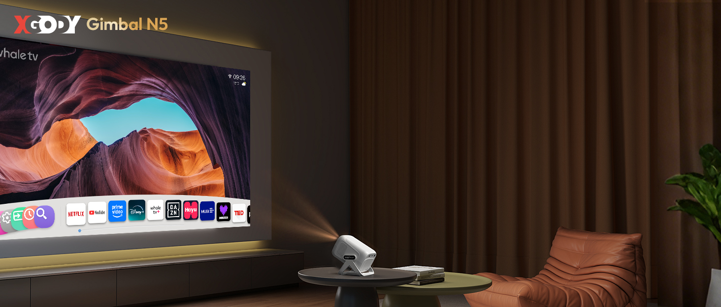 Text shows 'XDO-Y'. Living room setting with projected display showing colorful interface on wall above entertainment setup.