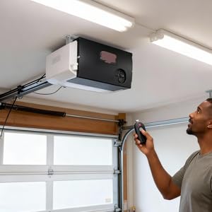 A person holds the new remote and presses the button to sync it with the opener.