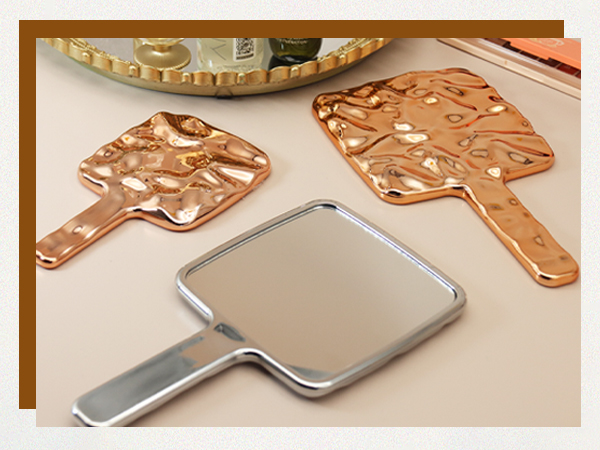 handheld mirror with held