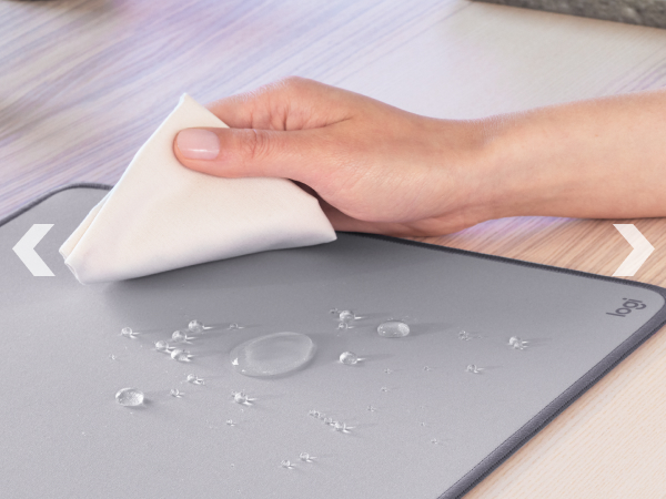 zoom of a woman cleaning studio series desk mat large light gray mouse pad
