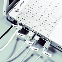 Computer ports all with tiny identifying label of what each port connects to