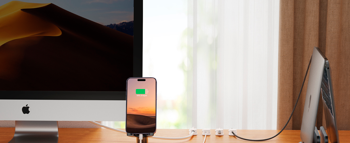 magnetic cable holders being used on a desktop