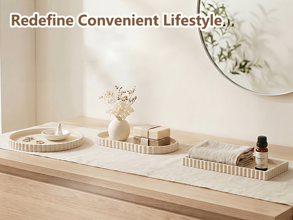 Text reads 'Redefine Convenient Lifestyle'. Minimalist white vanity surface styled with decorative tray, small containers, and personal items. Natural lighting from a round mirror reflected on wall creating serene home décor aesthetic.
