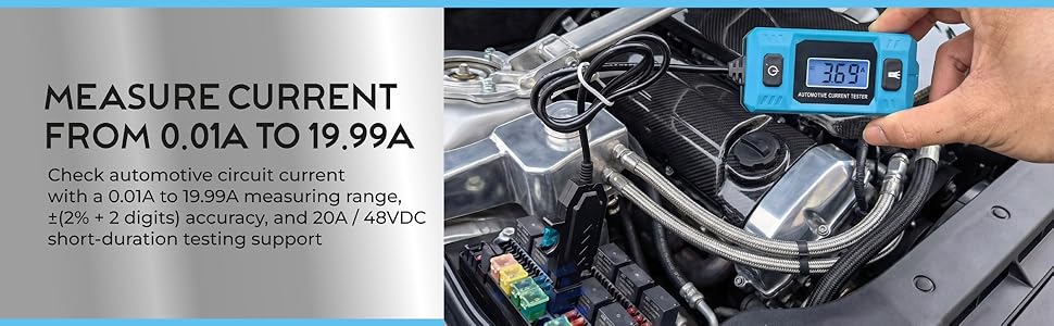 A person uses a blue digital tester to measure electrical current in a car engine bay fuse box