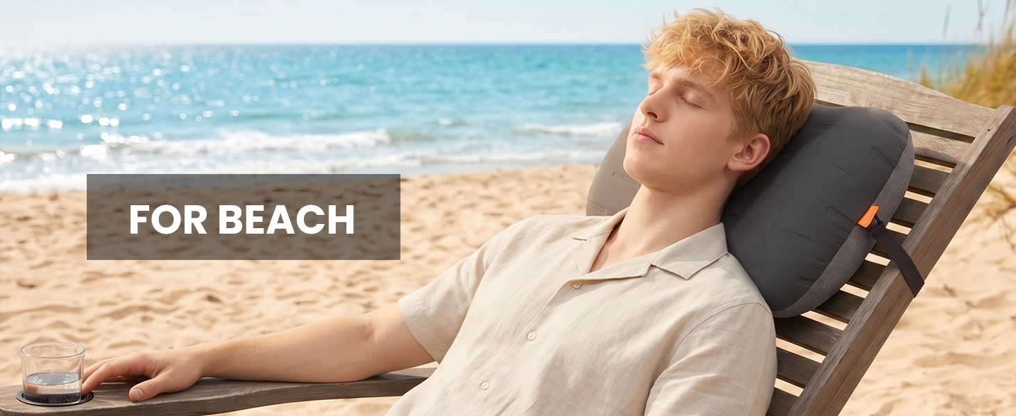 Beach pillow providing neck support on a lounge chair by the ocean.