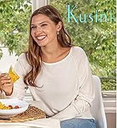 woman enjoying nachos and cheese with the Kusini Fondue Maker