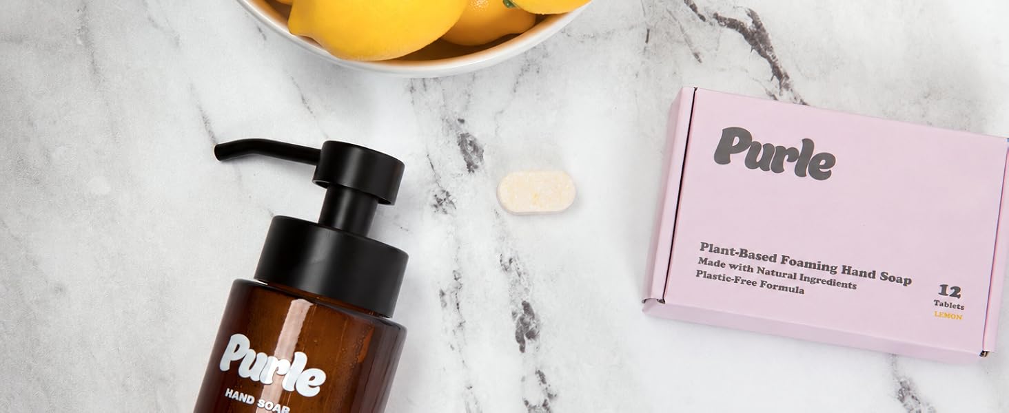 Purle foaming hand soap tablet, dispenser and packaging on marble countertop