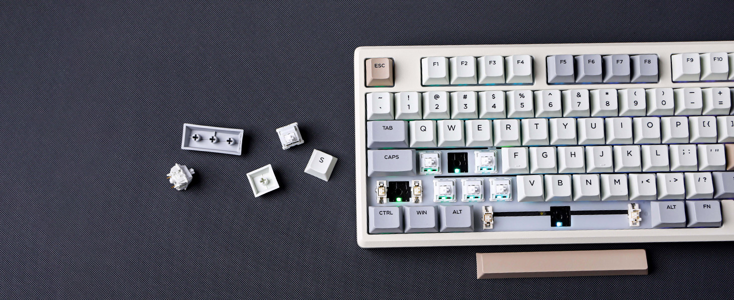a computer keyboard with a broken keyboard and a dice.