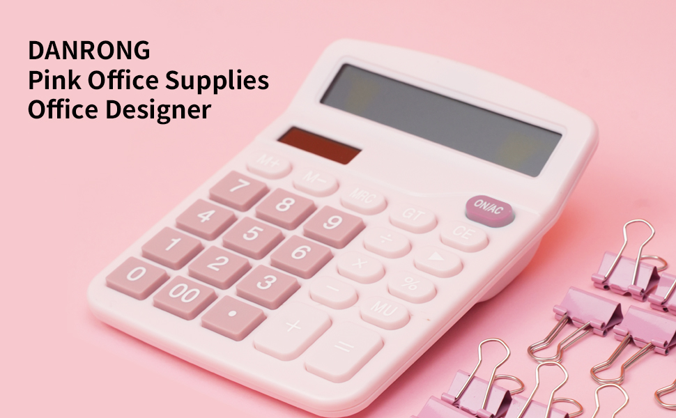 Some pink binder clips are placed next to the pink calculator