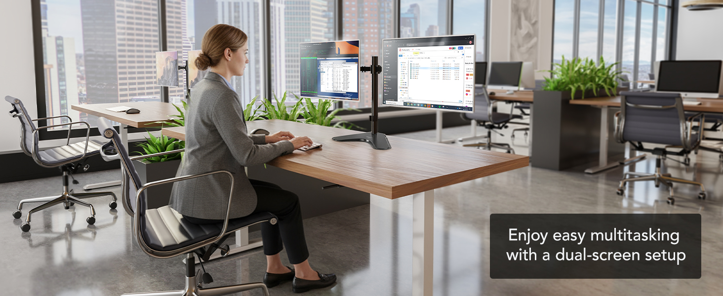 Office scene with dual monitors on a pole mount for easy multitasking.